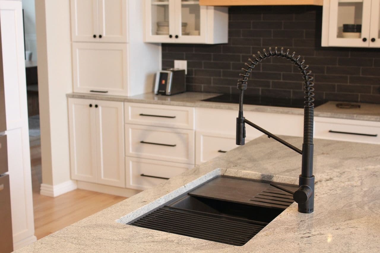marble counter top black faucet