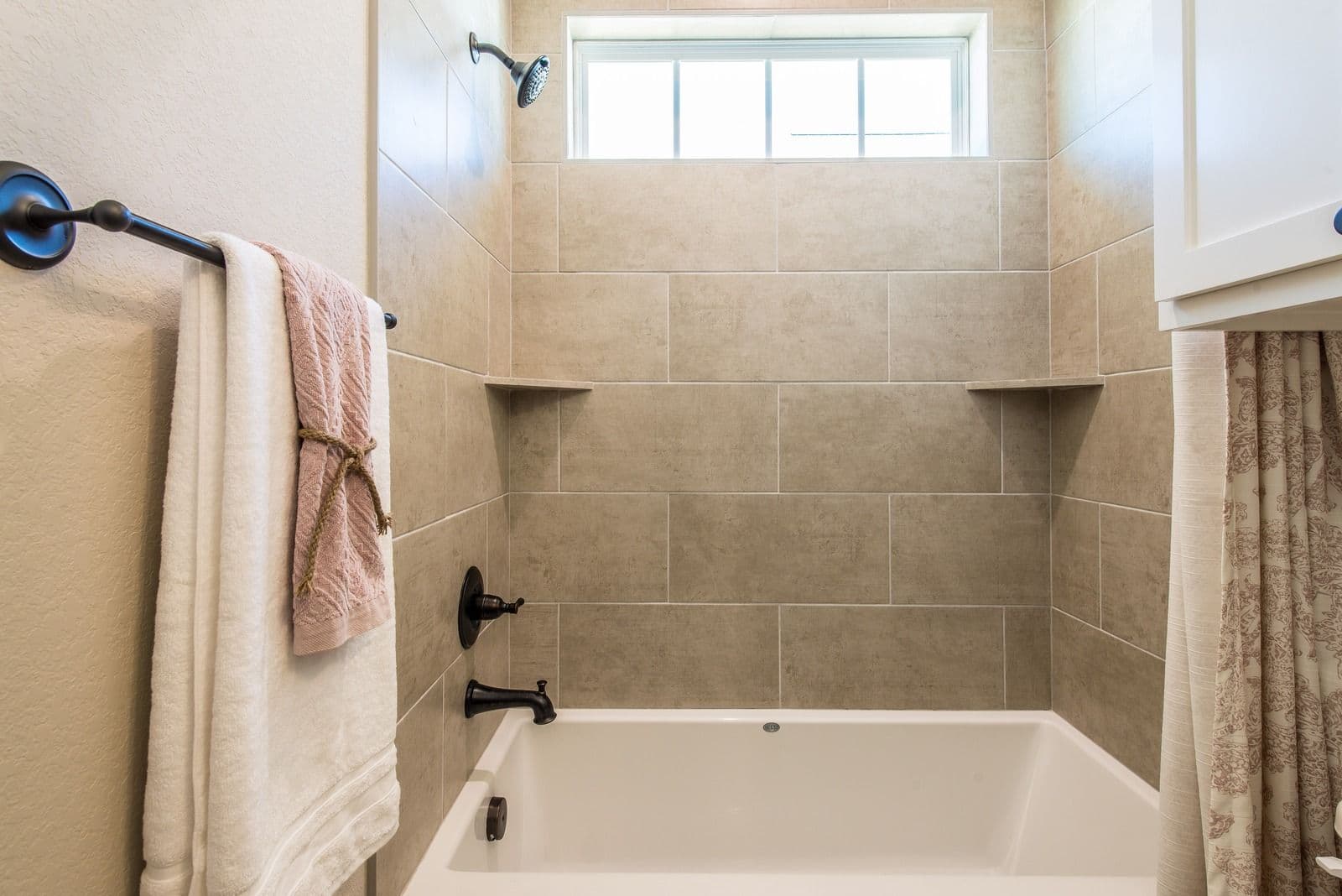 marble brown tiling rectangle tub bathroom