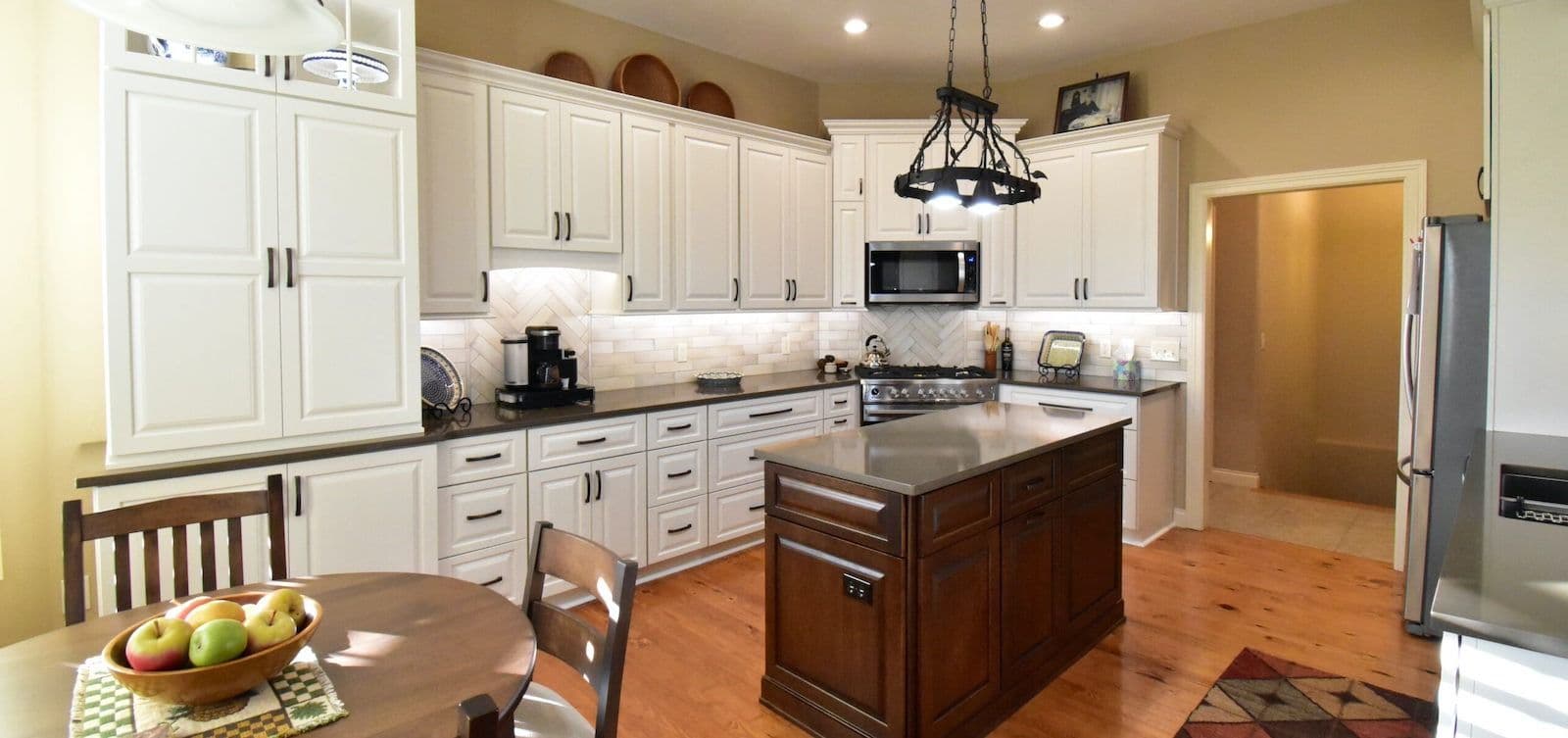 white cabinets brown island