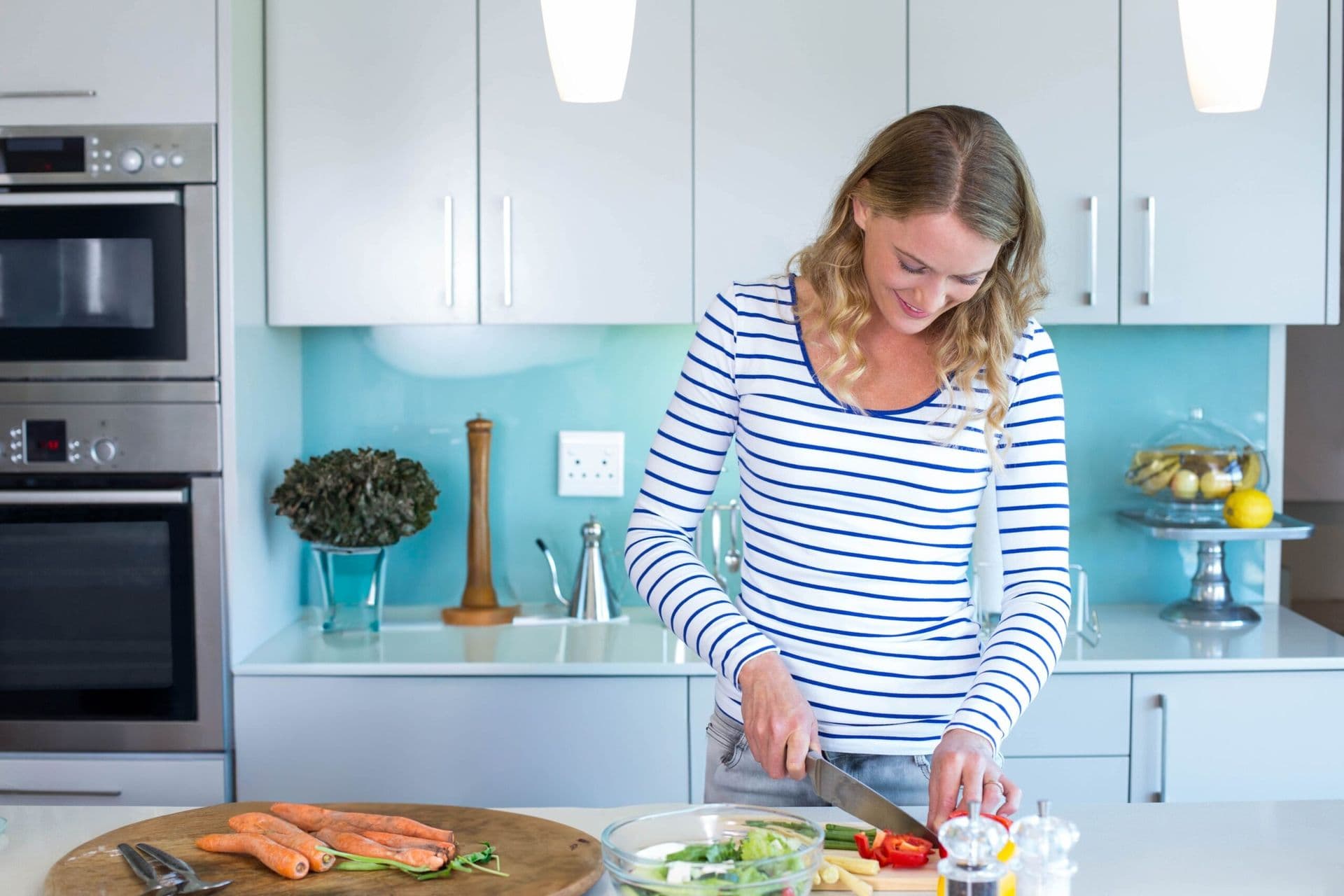 women chopping peppers