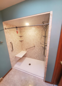 Walk-in shower with seat and grab bars