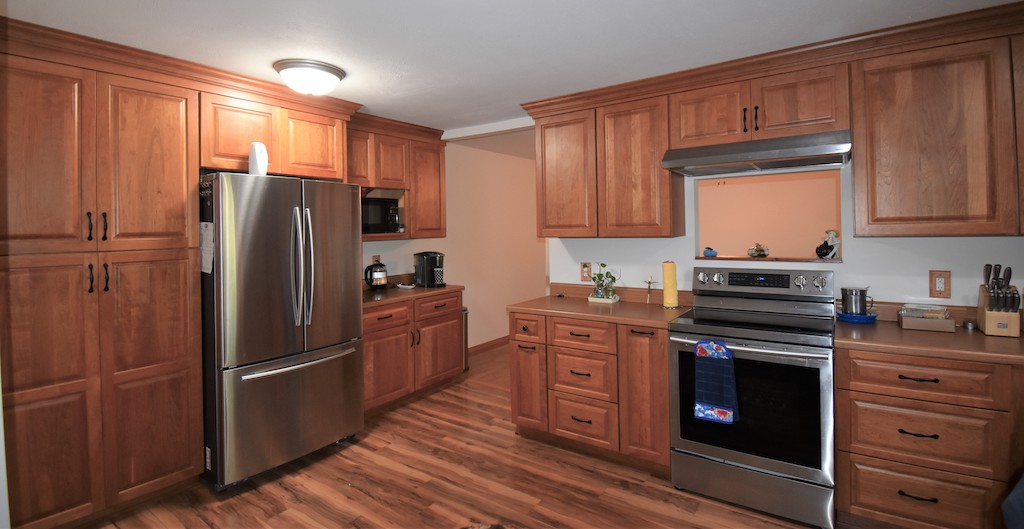 Get top tier kitchen cabinet remodeling with new brown cabinets