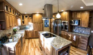 An eclectic kitchen featuring natural wood finish cabinetry